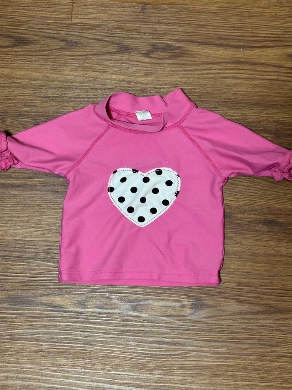 Ruffle Butts Rashgaurd size 12-18 months Pink heart print with ruffle sleeve
